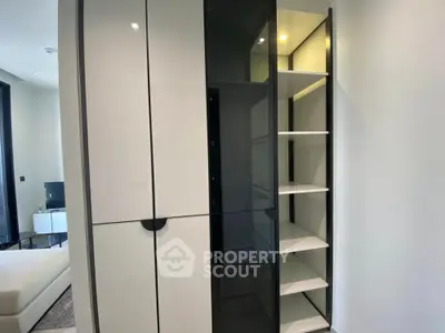 Modern storage unit with sleek design and ample shelving in contemporary apartment