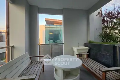 Modern balcony with stylish seating and scenic view