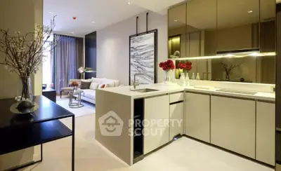 Modern open-layout kitchen and living room with elegant decor and natural light