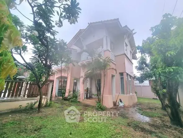 Charming two-story house with lush garden and spacious exterior