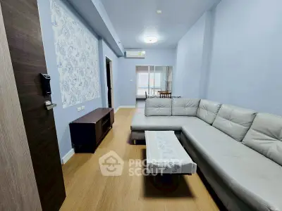 Spacious living room with modern L-shaped sofa and elegant decor