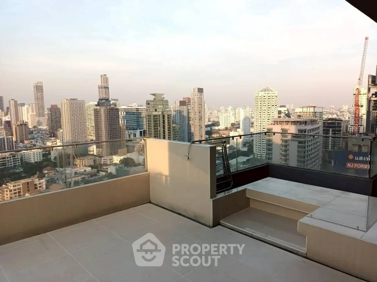 Stunning rooftop terrace with panoramic city skyline views, perfect for urban living and entertaining.