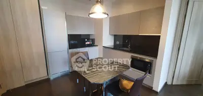 Modern kitchen with sleek cabinetry and elegant dining area