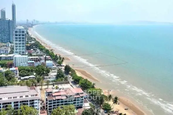 Stunning beachfront view with high-rise buildings and sandy shores