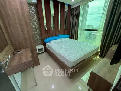 Modern bedroom with stylish wood accents and large window view.