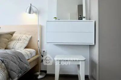Modern bedroom with stylish decor and cozy lighting