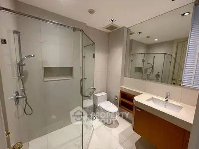 Modern bathroom with glass shower and sleek fixtures
