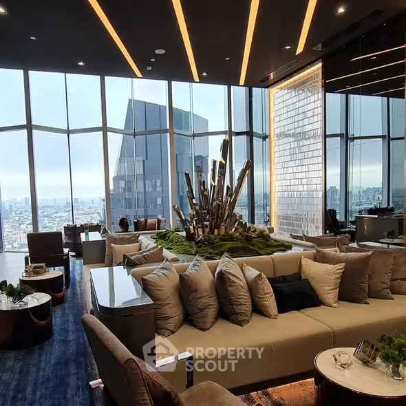 Luxurious high-rise living room with panoramic city views and modern decor.