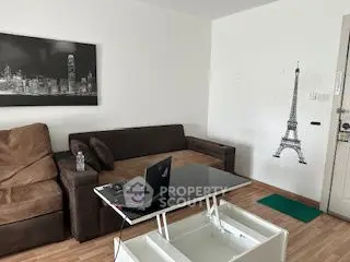 Modern living room with stylish decor and comfortable seating in a cozy apartment.