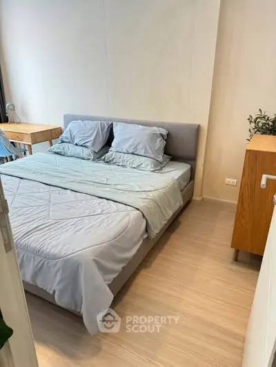 Cozy modern bedroom with stylish furniture and soft lighting