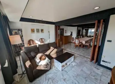 Spacious living room with elegant dining area and modern decor