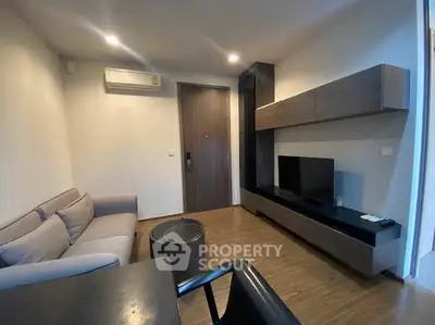 Modern living room with sleek furniture and wooden flooring