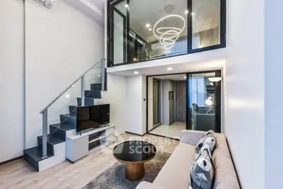 Modern duplex living room with stylish staircase and elegant lighting