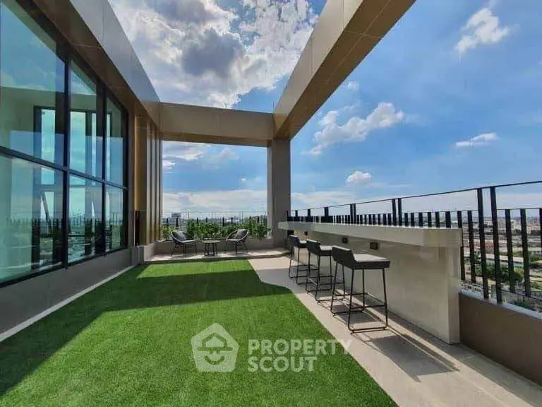 Stunning rooftop terrace with panoramic city views and modern seating area.