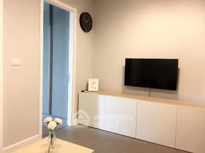 Modern living room with sleek TV setup and minimalist decor
