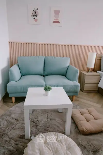 Charming living room with cozy sofa and modern decor, perfect for relaxation.