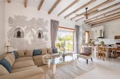 Stunning open-plan living room with rustic beams and modern decor