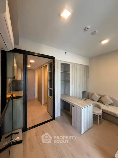 Modern living room with sleek design and open kitchen layout