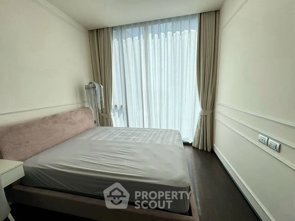 Cozy bedroom with elegant curtains and natural light