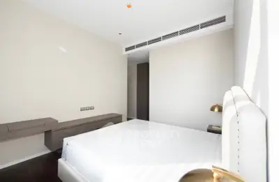 Bright and modern bedroom with sleek furniture and minimalist design, perfect for a cozy retreat.