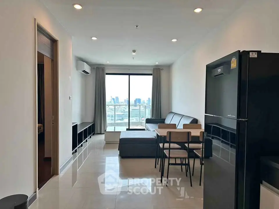 Modern living room with city view, featuring sleek furniture and open layout, perfect for urban living.