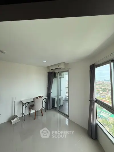 Bright study room with balcony view in modern apartment