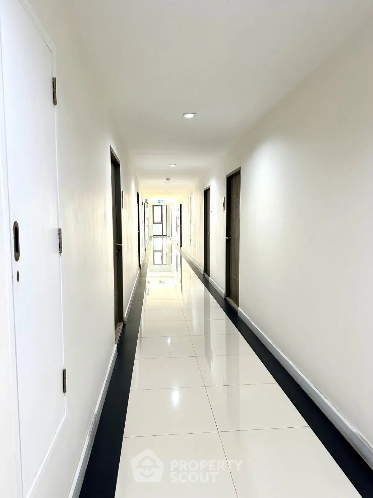 Bright and spacious apartment hallway with sleek modern design