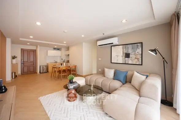 Spacious modern living room with open kitchen and stylish decor