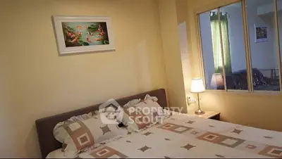 Cozy bedroom with stylish decor and soft lighting, perfect for relaxation.