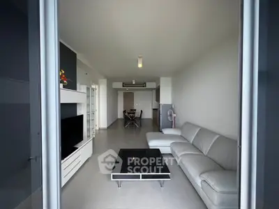 Spacious modern living room with sleek furniture and open layout