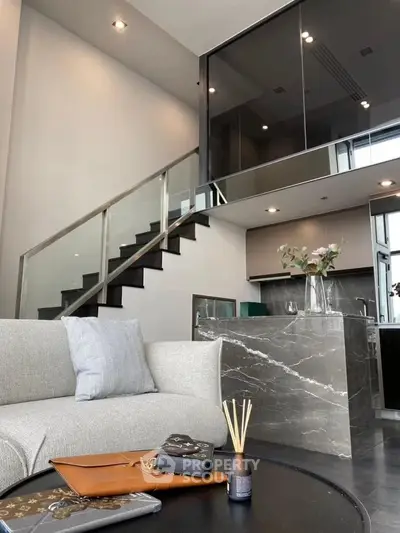 Modern duplex living room with sleek staircase and stylish decor