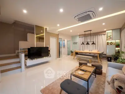 Spacious modern living room with elegant decor and open layout, perfect for family gatherings.