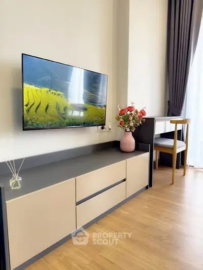 Modern living room with sleek TV unit and elegant decor