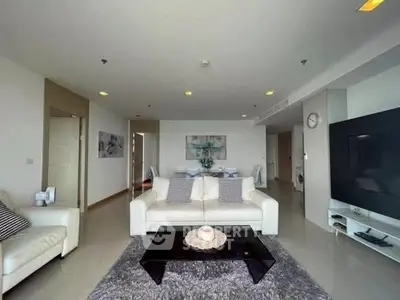 Spacious modern living room with elegant decor and large TV