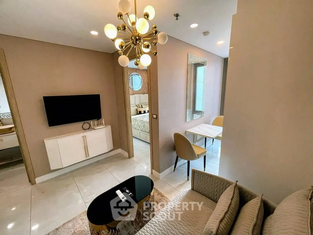 Luxurious modern living room with elegant chandelier and stylish decor
