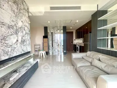 Luxurious modern living room with marble accents and sleek furniture in a high-end apartment.