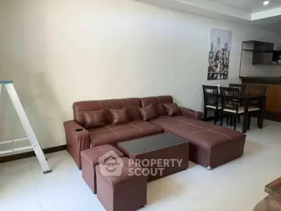 Modern living room with stylish brown sectional sofa and dining area