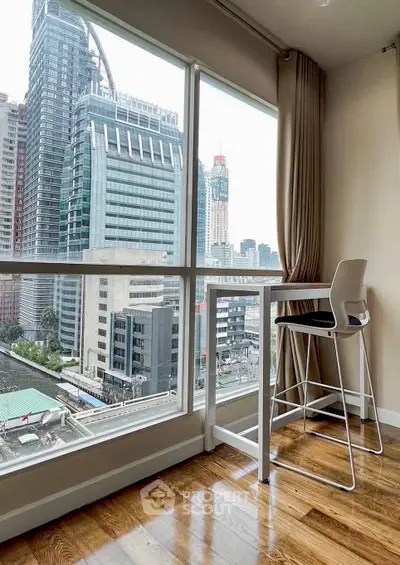 Modern high-rise apartment with stunning city view and sleek interior design.