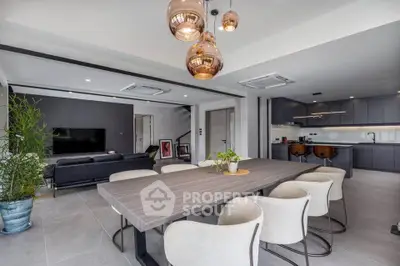 Luxurious open-plan living and dining area with modern kitchen and stylish decor