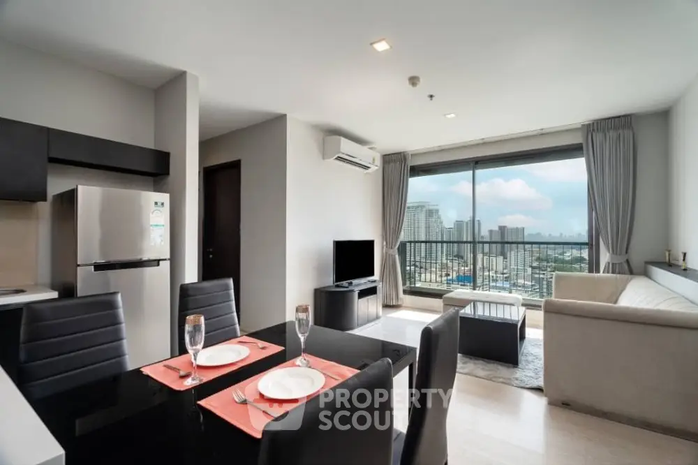 Modern open-plan living room with city view balcony in luxury apartment