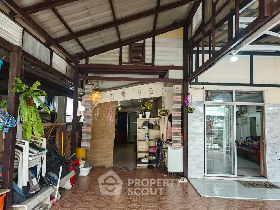 Charming rustic interior with high ceilings and eclectic decor, perfect for creative living spaces.