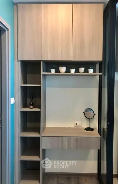 Modern study nook with wooden shelves and desk, ideal for compact spaces.