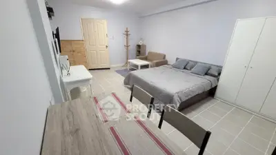 Spacious studio apartment with modern furnishings and cozy ambiance