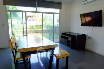 Modern living room with large windows and sleek furniture