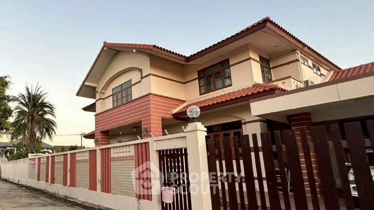 Stunning two-story house with modern architecture and spacious outdoor area.