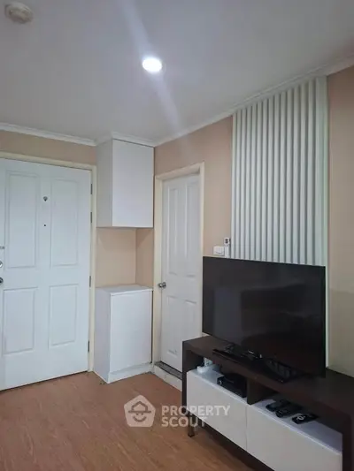 Cozy living room with modern TV setup and stylish decor