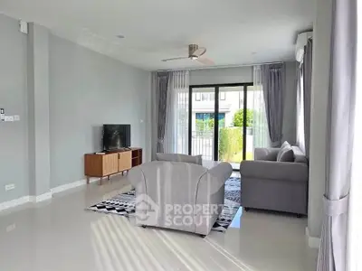 Spacious modern living room with elegant furniture and natural light