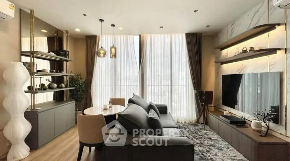 Luxurious modern living room with elegant decor and large windows