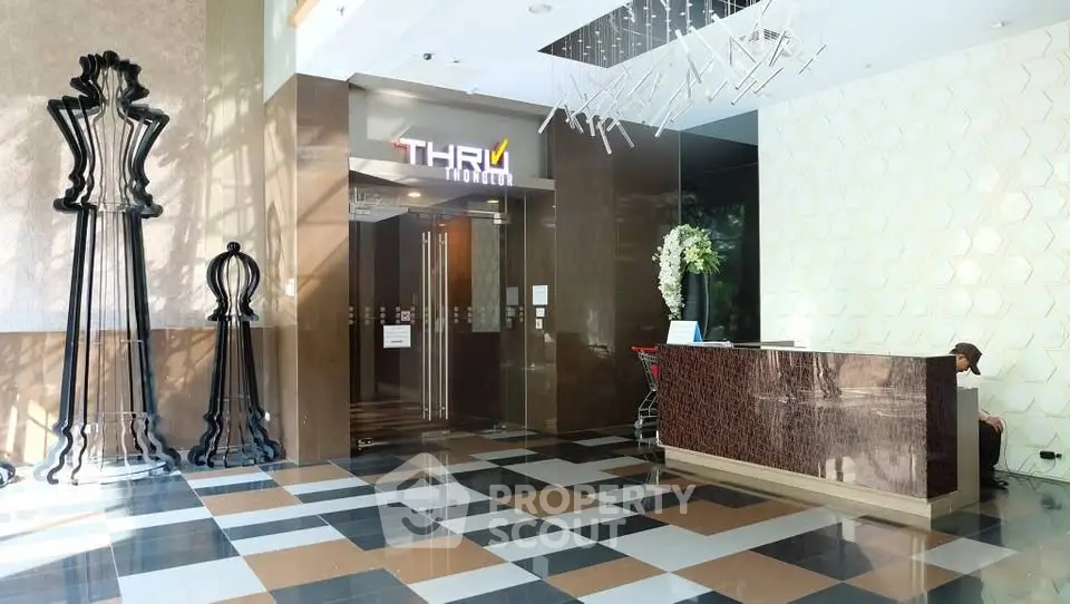 Elegant building entrance with modern decor and reception desk