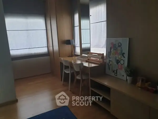Cozy study room with wooden flooring and modern decor